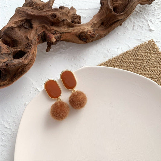 Classic brown pom pom earrings