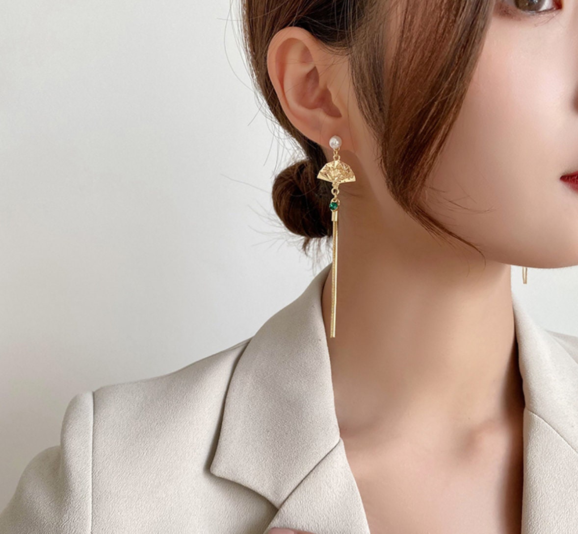 Gold oriental fan tassel earrings